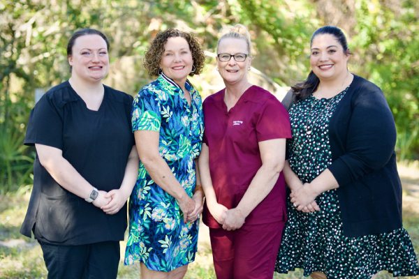 The staff at Trinity Hearing & Balance welcoming you to their practice